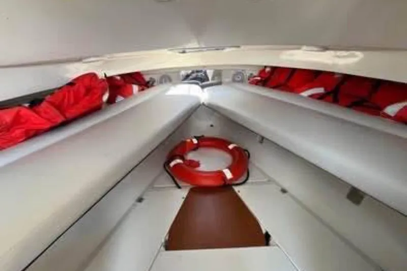 Slide: The Image of Interior of 2011 Sailfish 2660 WAC boat with life jackets and lifebuoy. - 6