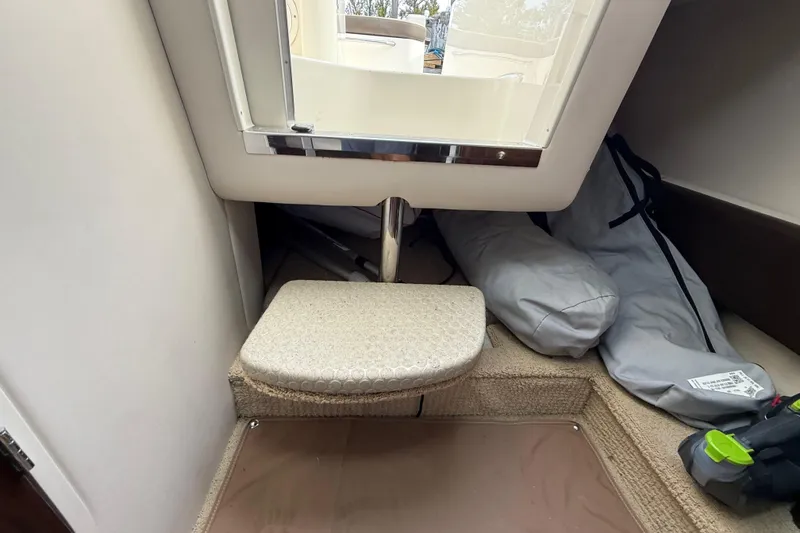 Slide: The Image of Interior cabin of 2015 Sea Ray 260 Sundancer with step and storage area. - 20