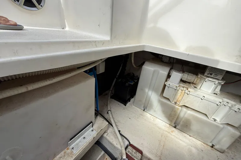 Slide: The Image of Interior view of a 2015 Sea Ray 260 Sundancer boat's engine compartment. - 25