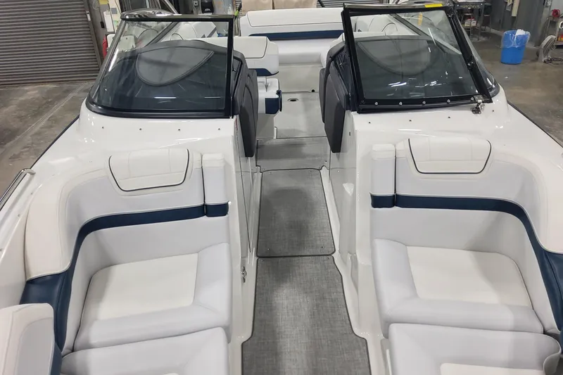 Slide: The Image of 2026 Formula 270 Bowrider interior with white and blue seating, sleek design. - 15