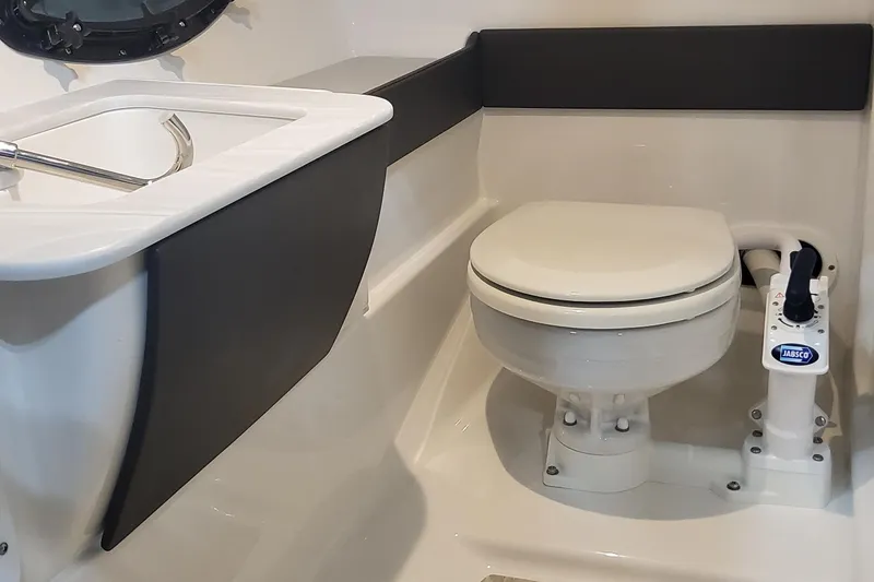 Slide: The Image of 2026 Formula 270 Bowrider boat bathroom with toilet and sink. - 19