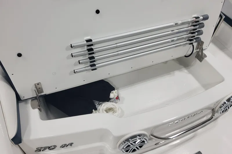 Slide: The Image of 2026 Formula 270 Bowrider storage compartment with mounted poles and speakers. - 21
