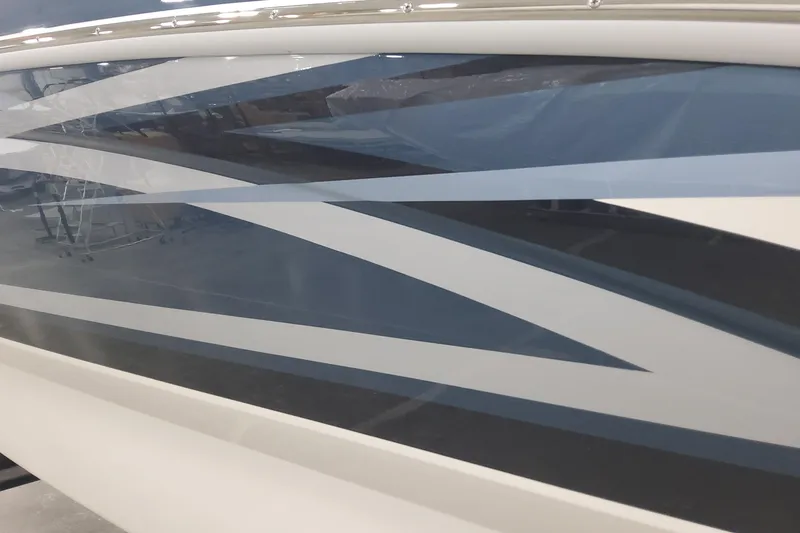 Slide: The Image of Side view of 2026 Formula 270 Bowrider boat with sleek blue and white design. - 3