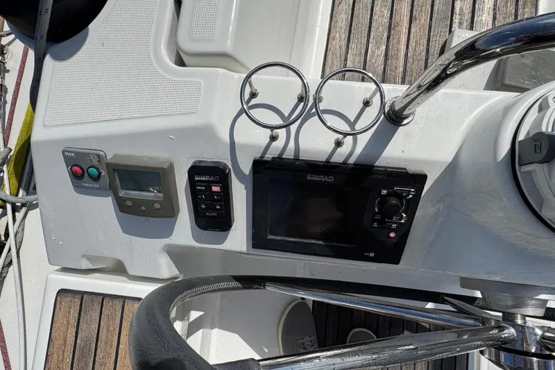 Slide: The Image of Beneteau Oceanis 45 yacht helm with Simrad controls and cup holders, 2013 model. - 11