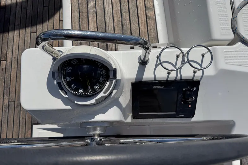 Slide: The Image of Cockpit of 2013 Beneteau Oceanis 45 with compass and Simrad navigation system. - 12