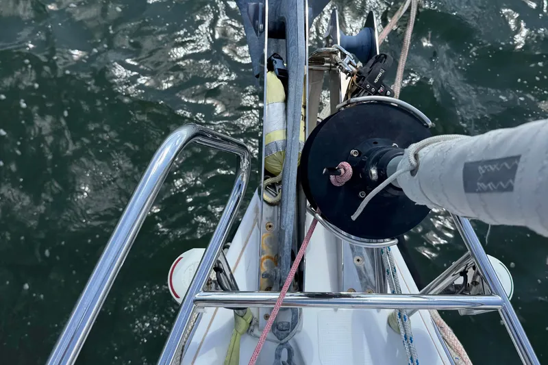 Slide: The Image of Beneteau Oceanis 45 sailboat deck view, showcasing rigging and water reflection. - 21