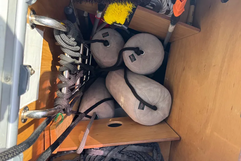 Slide: The Image of Storage compartment on a 2013 Beneteau Oceanis 45 with ropes and fenders. - 23