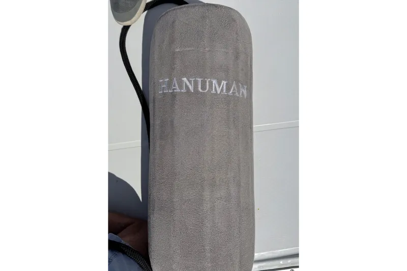 Slide: The Image of Gray fender on Beneteau Oceanis 45, 2013, with "HANUMAN" text. - 24