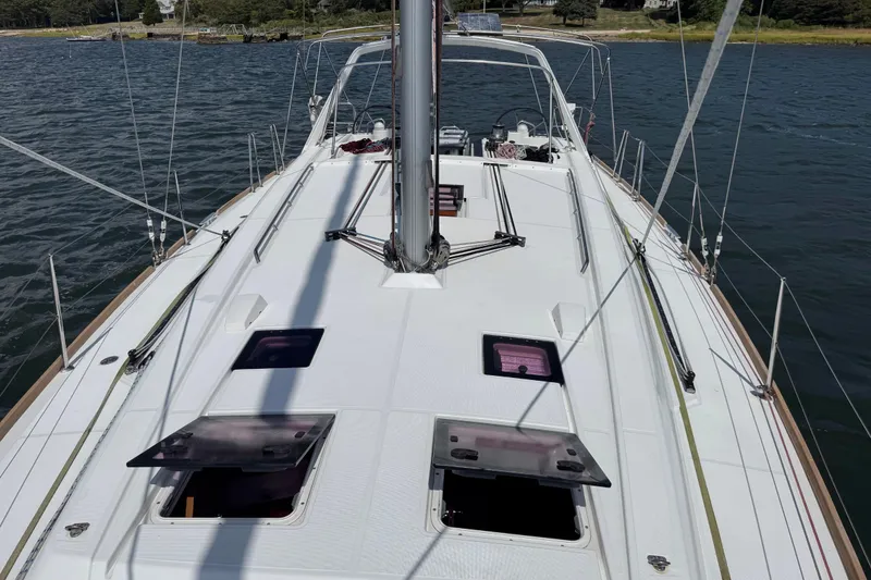 Slide: The Image of 2013 Beneteau Oceanis 45 sailboat deck view on calm water. - 25