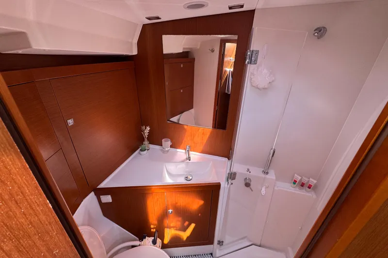 Slide: The Image of Luxurious bathroom interior of 2013 Beneteau Oceanis 45 yacht, featuring modern fixtures and wood accents. - 31