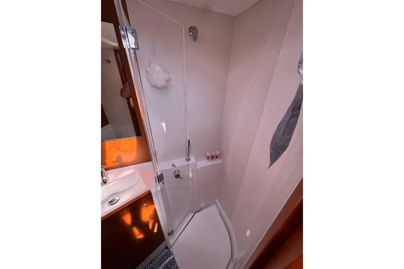 Slide: The Image of Bathroom interior of 2013 Beneteau Oceanis 45 yacht, featuring shower and sink. - 32