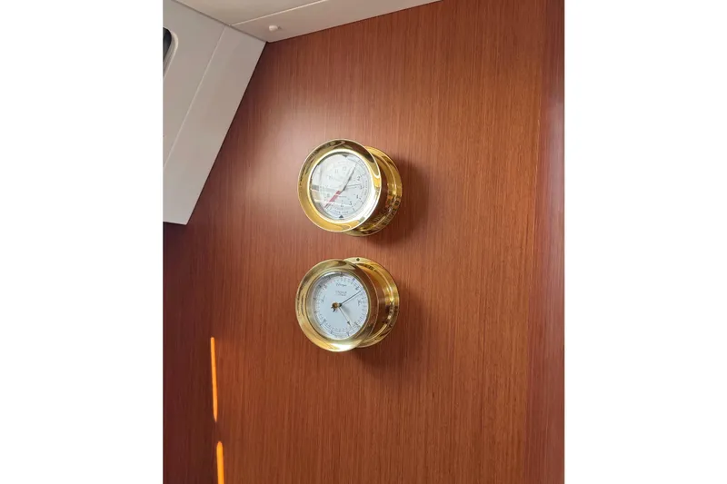 Slide: The Image of Gold nautical instruments on Beneteau Oceanis 45 yacht's wooden interior wall, 2013 model. - 37