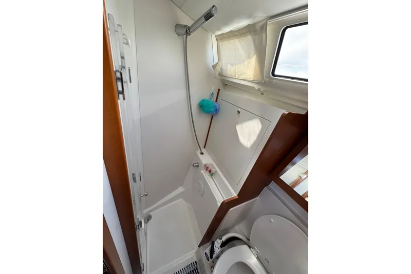 Slide: The Image of Bathroom interior of 2013 Beneteau Oceanis 45 yacht, featuring shower and toilet. - 38