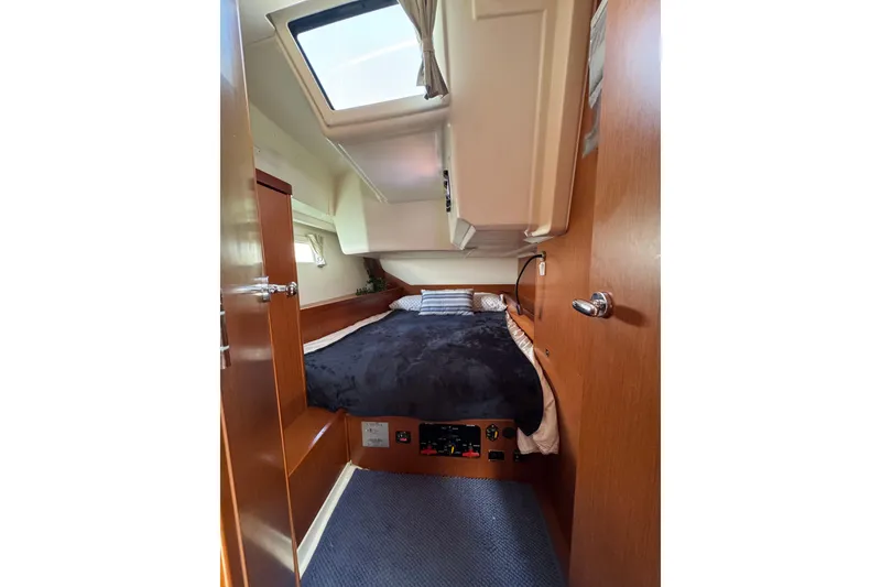 Slide: The Image of Cozy cabin interior of 2013 Beneteau Oceanis 45 sailboat with skylight and wooden finishes. - 41