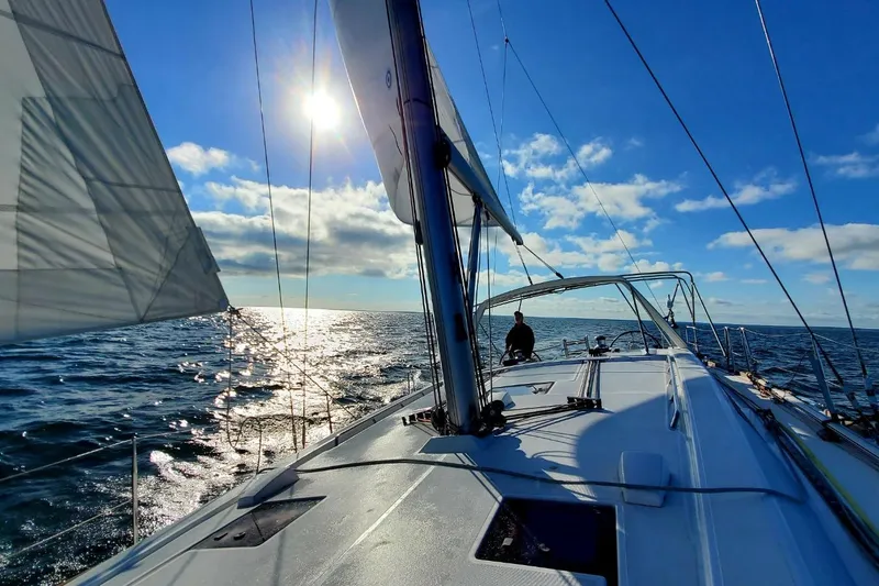 Slide: The Image of Sailing on a 2013 Beneteau Oceanis 45 yacht under a clear blue sky. - 5