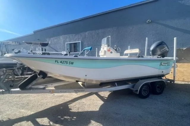 Slide: The Image of 2021 Carolina Skiff 21 LS boat on trailer, parked outdoors. - 1