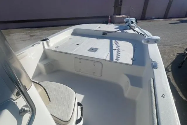 Slide: The Image of 2021 Carolina Skiff 21 LS boat interior with seating and storage compartments. - 13