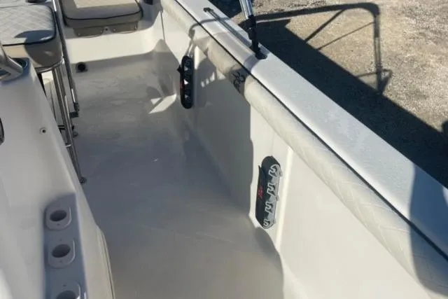 Slide: The Image of 2021 Carolina Skiff 21 LS boat interior with seating and rod holders. - 17