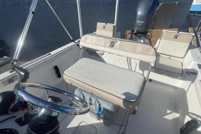 Slide: The Image of 2021 Carolina Skiff 21 LS boat interior with steering wheel and seating. - 18