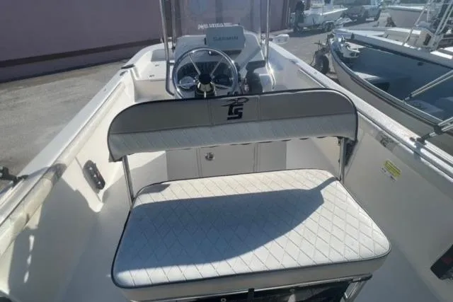 Slide: The Image of 2021 Carolina Skiff 21 LS boat interior with steering console and seating. - 21