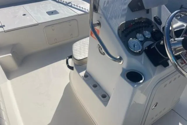Slide: The Image of 2021 Carolina Skiff 21 LS boat interior with steering console and seating area. - 23