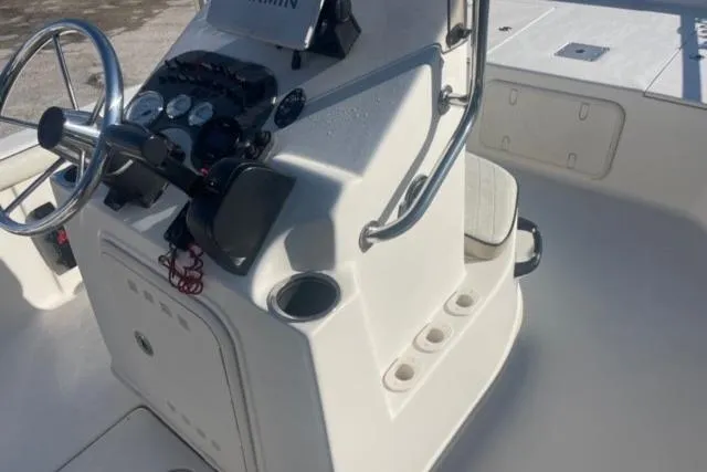 Slide: The Image of 2021 Carolina Skiff 21 LS boat console with steering wheel and controls. - 24