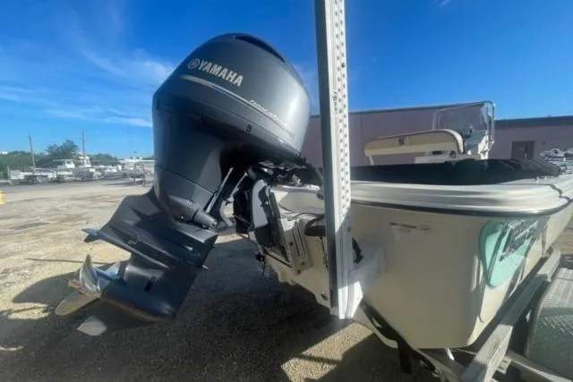 Slide: The Image of 2021 Carolina Skiff 21 LS boat with Yamaha outboard motor in a sunny outdoor setting. - 7