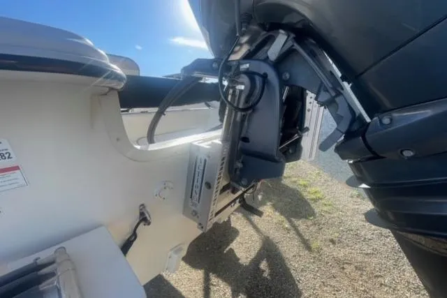 Slide: The Image of 2021 Carolina Skiff 21 LS boat engine and transom detail in sunlight. - 8