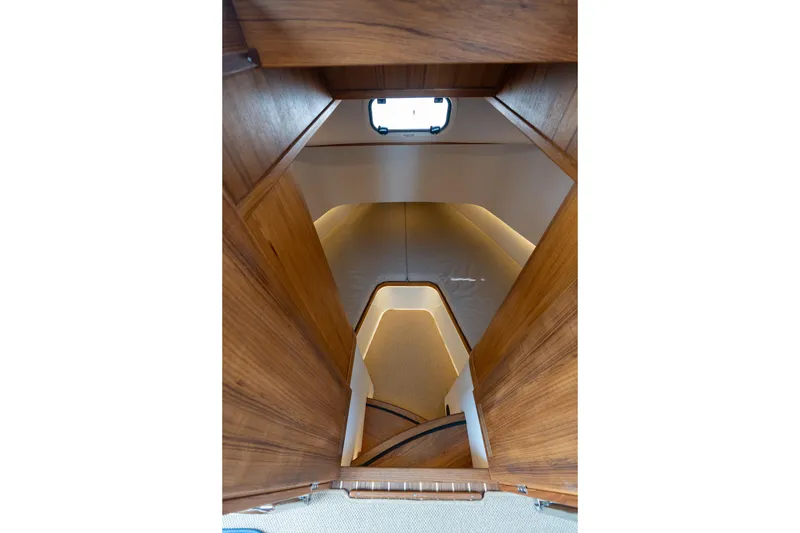 Slide: The Image of Interior view of 2026 Targa 32 GT boat cabin with wooden finish. - 39