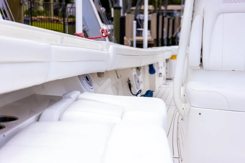 Slide: The Image of 2019 Regulator 34 boat interior with white seating and sleek design. - 16