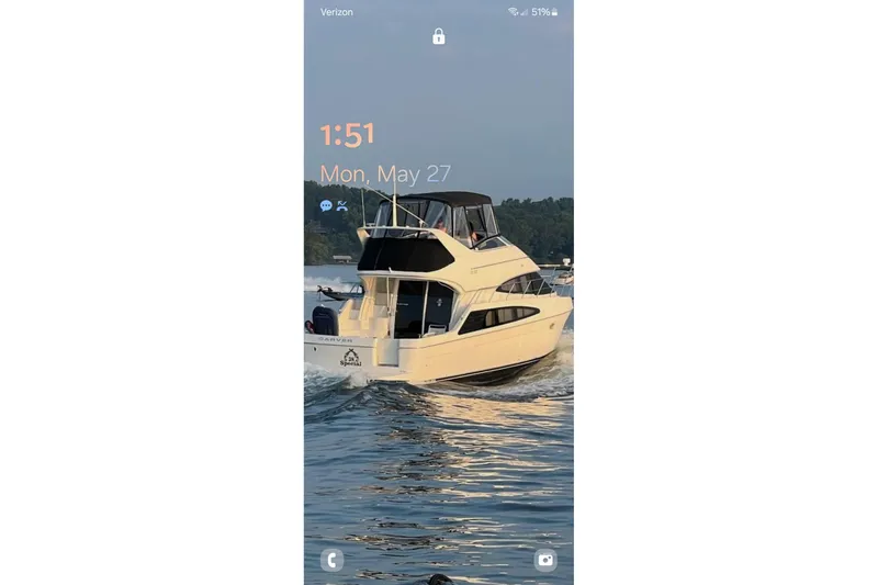 The Image of 2006 Carver 38 Super Sport yacht cruising on a sunny day, displaying phone lock screen. - 0