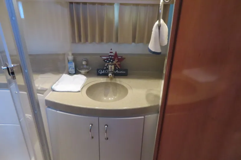 Slide: The Image of Bathroom interior of 2006 Carver 38 Super Sport yacht with sink and decor. - 12