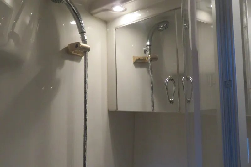 Slide: The Image of Shower area in 2006 Carver 38 Super Sport yacht with mirrored cabinets. - 13