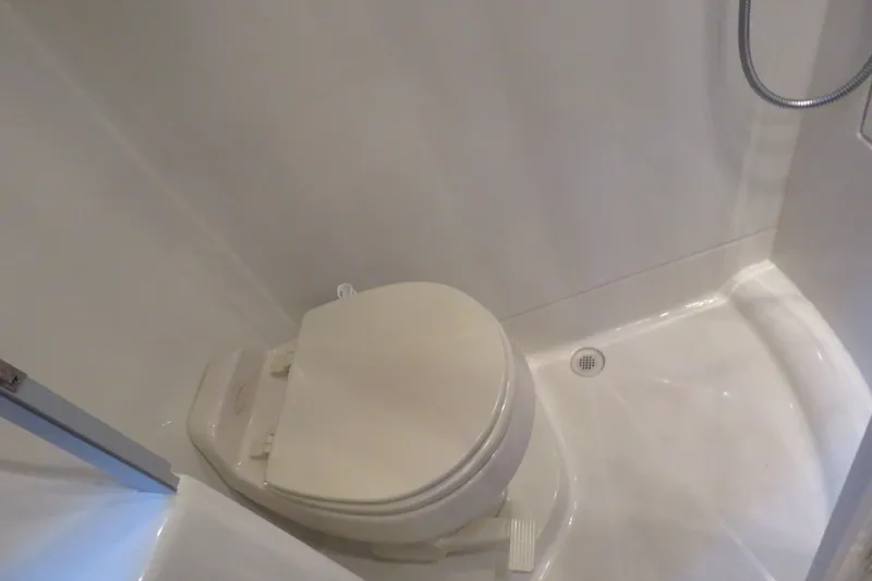 Slide: The Image of Compact bathroom in 2006 Carver 38 Super Sport yacht with toilet and shower. - 14