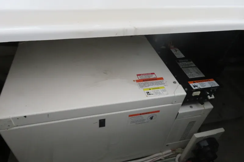 Slide: The Image of Engine compartment of a 2006 Carver 38 Super Sport boat with warning labels. - 17