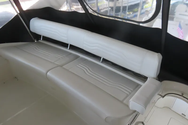 Slide: The Image of 2006 Carver 38 Super Sport boat interior with white leather seating. - 2