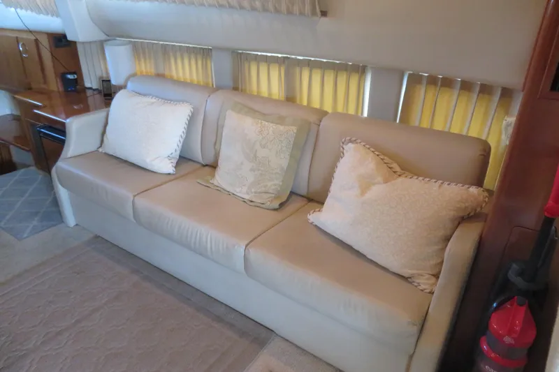 Slide: The Image of Luxurious interior of 2006 Carver 38 Super Sport yacht with beige sofa and cushions. - 6