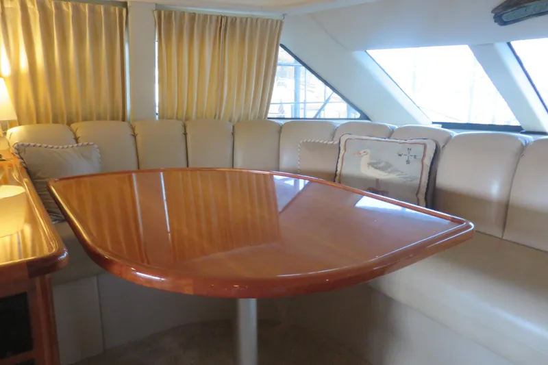 Slide: The Image of Luxurious interior of 2006 Carver 38 Super Sport yacht with elegant seating and table. - 7
