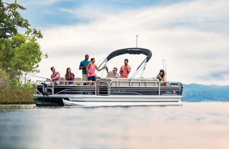 Slide: The Image of 2021 Sun Tracker Fishin' Barge 24 DLX on a lake with people enjoying fishing. - 3