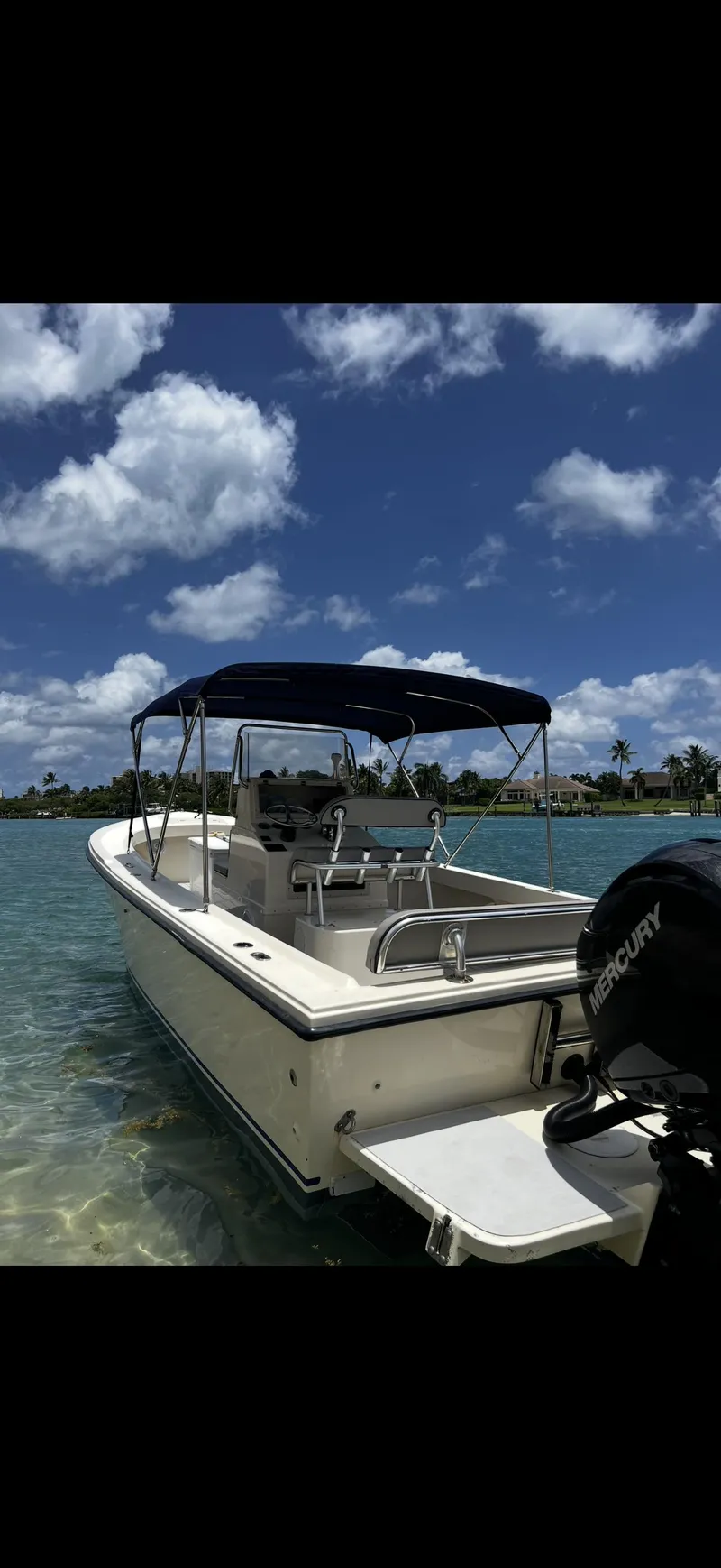 Slide: The Image of 2002 Parker 2500 Special Edition boat on clear water under blue sky. - 16