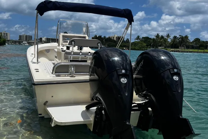 Slide: The Image of 2002 Parker 2500 Special Edition boat with dual engines on clear water. - 3