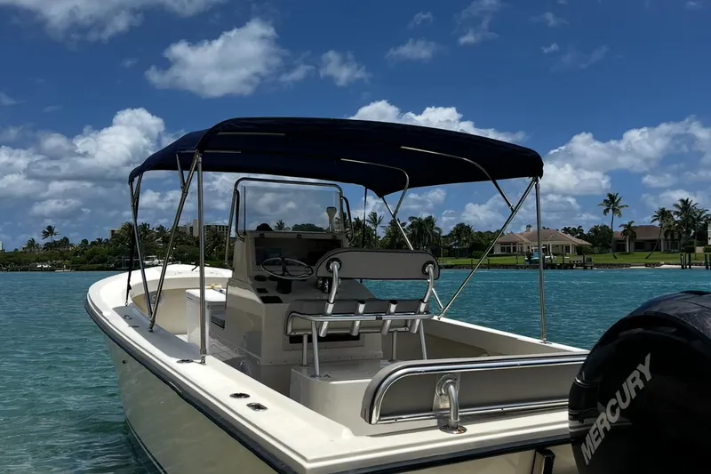 Slide: The Image of 2002 Parker 2500 Special Edition boat on clear blue water under a sunny sky. - 4