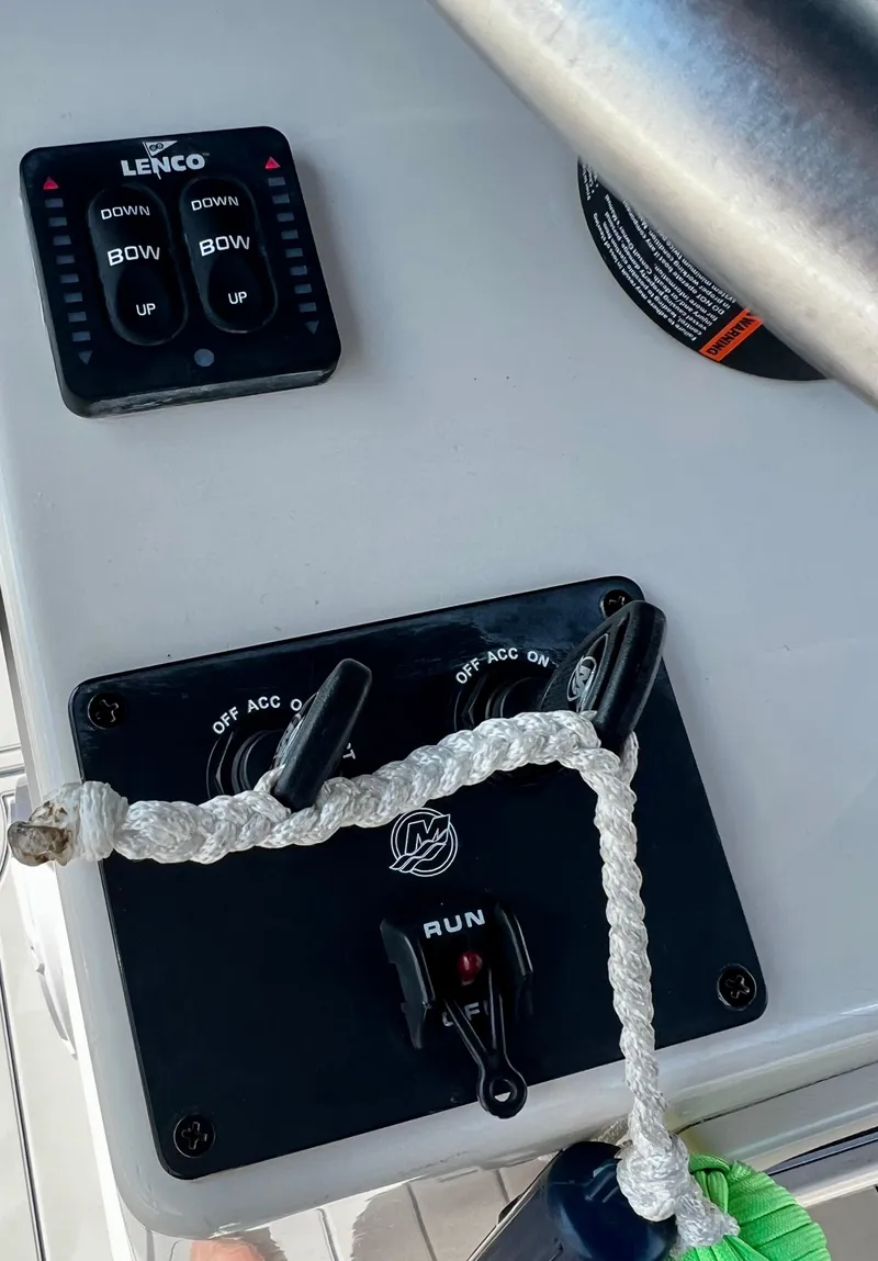 Slide: The Image of Control panel of a 2002 Parker 2500 Special Edition boat with Lenco trim tab switches. - 8