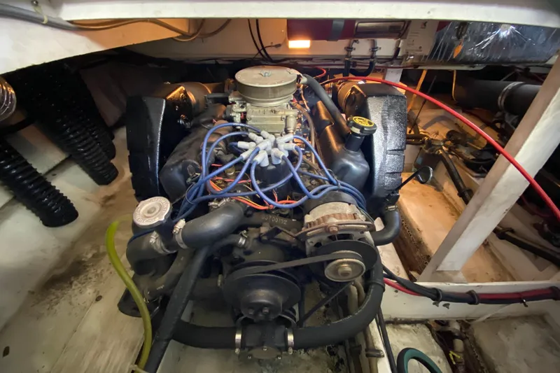 Slide: The Image of Engine compartment of 1989 Bayliner 3888 Motoryacht, showcasing detailed mechanical components. - 33