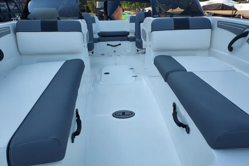 Slide: The Image of 2026 Tahoe T21 boat interior with gray and white seating, spacious layout. - 2