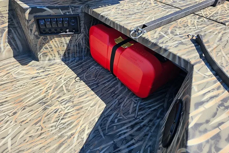 Slide: The Image of Camouflage interior of 2026 Tracker Grizzly 1650 T Prairie Wings Edition with red fuel tank. - 10