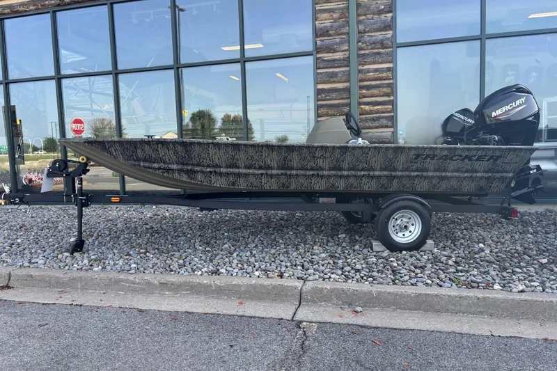 The Image of 2026 Tracker Grizzly 1648 SC boat on trailer, displayed outdoors. - 0