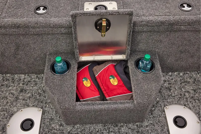 Slide: The Image of Open storage compartment in 2026 Tracker Pro Guide V-175 WT boat, featuring carpeted interior. - 26