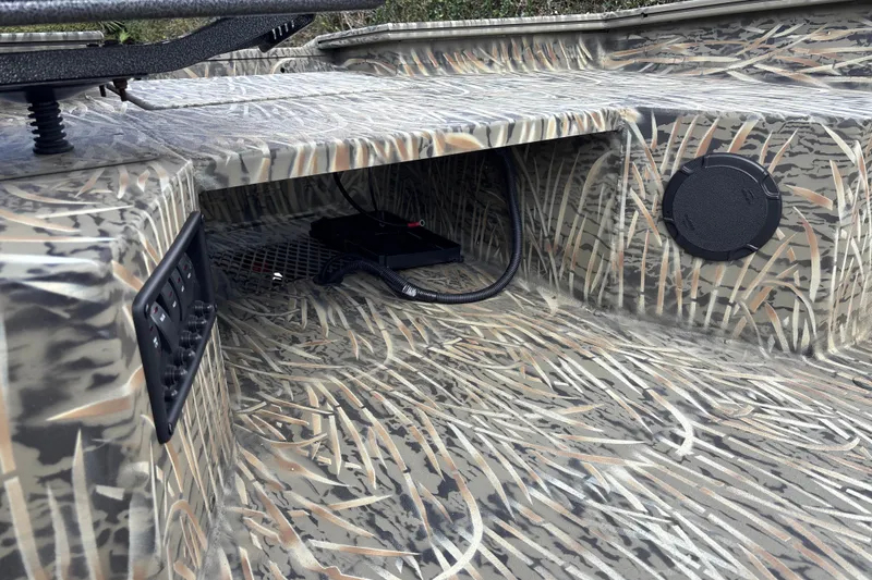 Slide: The Image of 2026 Tracker Grizzly 1650 T Prairie Wings Edition with camo interior detailing. - 17