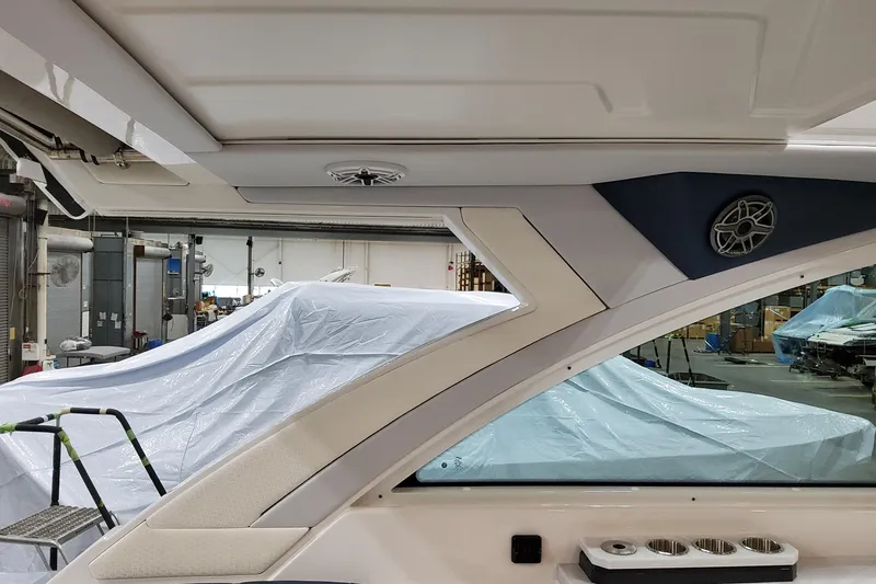 Slide: The Image of Interior view of 2026 Formula 380 Super Sport Crossover OB boat in a workshop. - 105